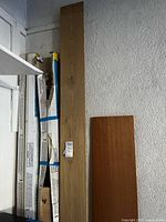 sealed and opened flooring boxes leaning against wall