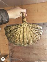 Side view of wicker basket showing weave and handle