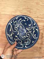 Top view showing interior scroll decoration and blue glaze