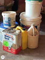 Front view of chemical containers and buckets