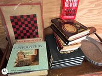 Overall view of mixed book lot on wooden surface