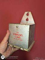 Front view showing Robinson’s Cones lettering and dispensing rods