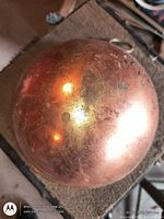 Top view of copper jelly mold showing tarnish and reflection