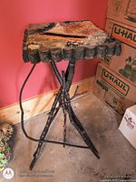 Full view of stand showing twig legs and fabric top