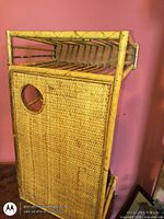 Side view showing woven wicker panel and bamboo frame