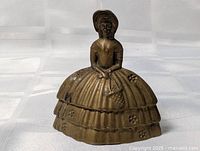 Full view of cast brass lady bell front