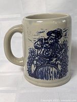 Front view of stoneware mug showing full graphic and handle