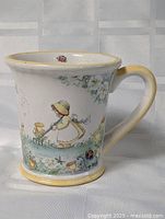 front view showing girl pushing ducklings artwork and handle