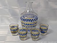 Full set showing decanter and four glasses