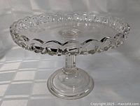 angled side view showing full pedestal cake platter and decorative rim