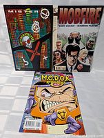 Front covers of all three comics