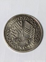 Reverse view displaying crossed checkered and U.S. flags, GOFUN logo, LIMITED EDITION NASCAR COIN COLLECTION text