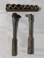Overall lot showing sockets on rail with two handles