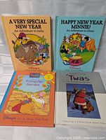 All four books front covers visible