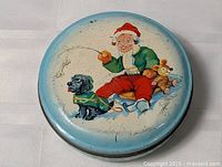 Top view showing full Christmas illustration on lid