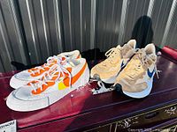 Both pairs Nike x Sacai sneakers on surface