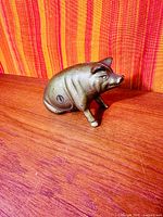 Left side view showing screw closure and gold paint finish