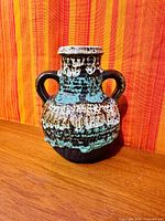 Front view of West German Fat Lava vase showing glaze and handles