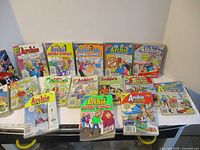 All sixteen Archie digest comic books laid out on table