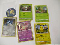 All five Pokémon cards laid out