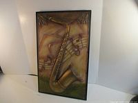 Front view of the full metal wall art showing saxophone and musical note design