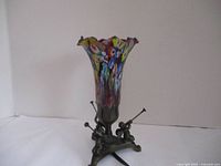 Full view of lamp unlit showing glass shade and cherub base