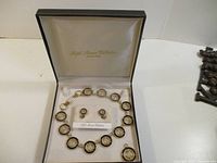 Full boxed set showing necklace, earrings, pendant in case