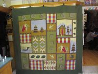 Full view of quilt hanging, showing overall design and green border