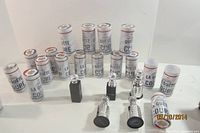 Group of sealed tubes and loose Stanley Cup shot glasses
