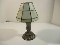 Full view assembled showing stained glass shade and ornate metal base