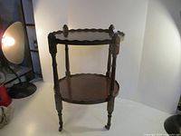 Full view of two-tier table showing design and finish