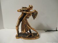 Full view of bronzed resin tango dancers statue