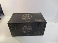 Full view of black wood/leather box with brass studs and latches