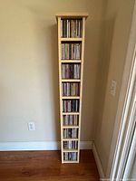 Full front view of CD tower filled with CDs