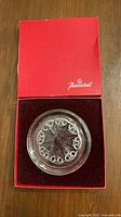Crystal wine dish inside red Baccarat box, lid open