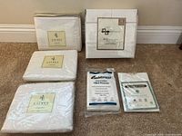 All six packaged bedding items displayed on carpet