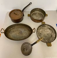Group shot showing all five copper cookware pieces
