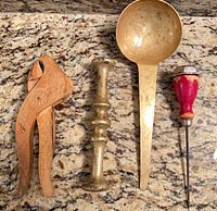 Group view of nutcracker, pestle, ladle, and ice cracker