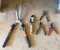 Group shot showing hedge shear, trowel, three pruners