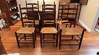 Front view showing all six ladder back chairs