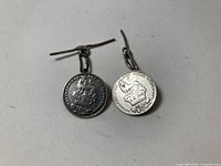 Both coin cufflinks showing obverse and reverse sides