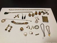 Full layout of assorted antique jewelry pieces