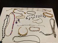 Overview of all jewelry pieces laid out on white surface