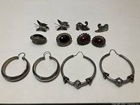 All six pairs of earrings laid out
