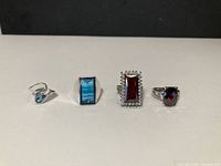 Four sterling silver rings arranged in a row