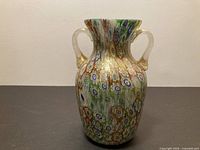 Full view of vase front showing millefiori pattern and handles