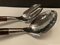 Close-up of hammered sterling heads on spoon and fork