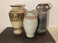Front view of all three vases showing shapes, colors and relative sizes