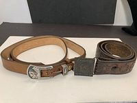 Two belts laid flat showing overall appearance