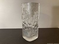Front view of clear textured square vase